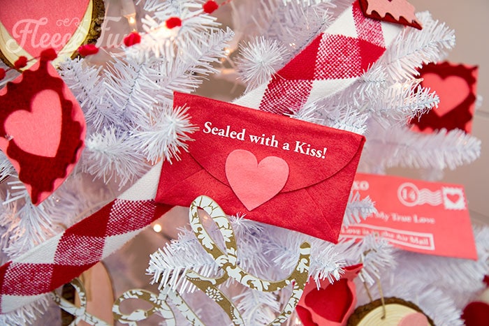 Finishing the Valentine envelope with custom decorative felt stamps inspired by fleecefun.