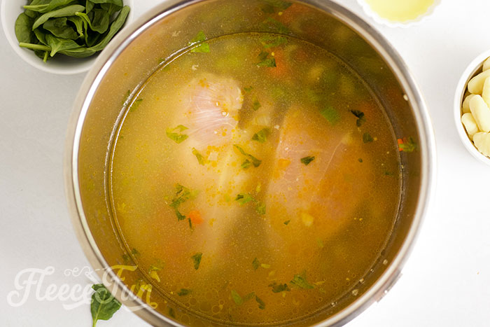 Pouring in the broth.
