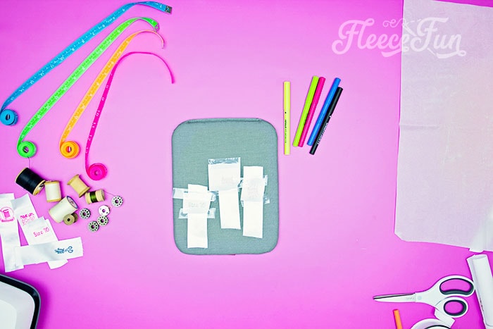 Step-by-step instructions for applying custom transfers to sewing labels with fleecefun tutorial
