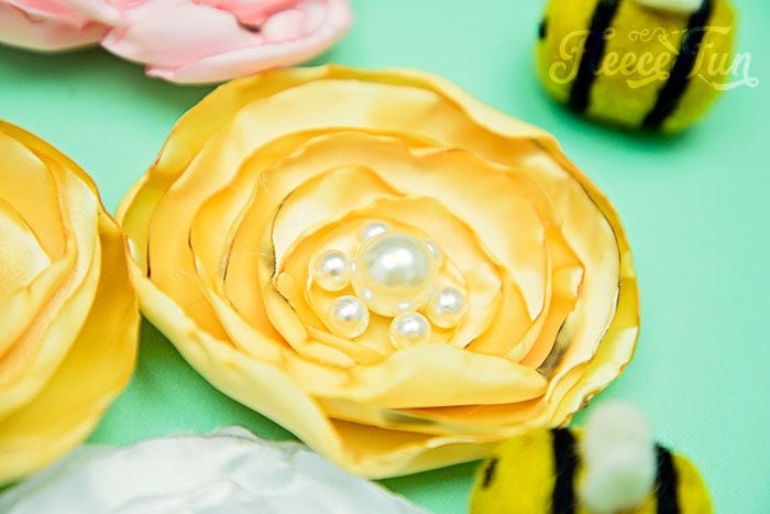 Soft and elegant satin flowers crafted with a free template and tutorial from fleecefun.