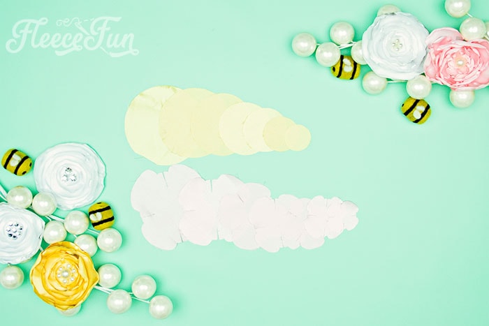 Create fabric flower petals by cutting the pattern with fleecefun’s free template