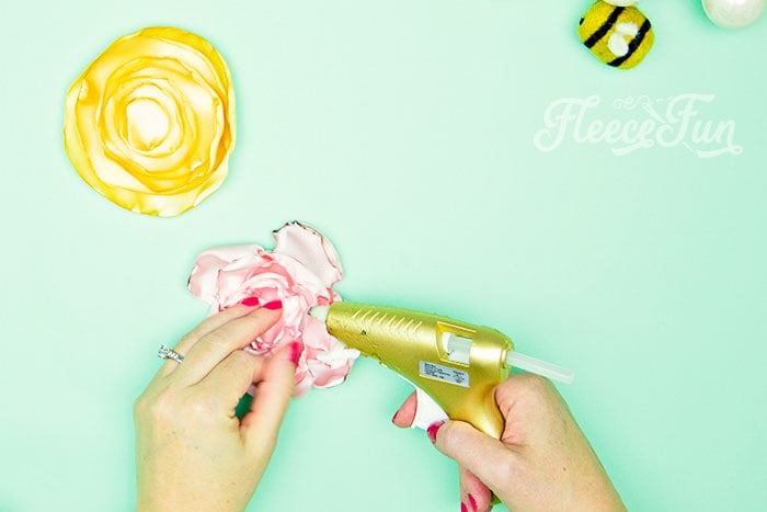 Gluing the no sew flowers together.