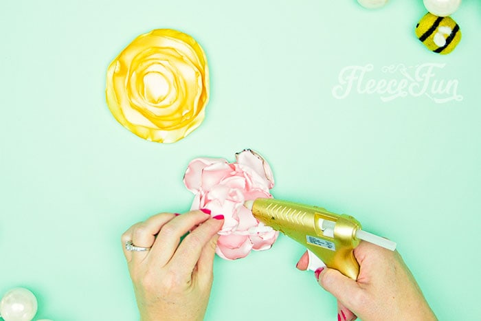 Gluing the no sew flowers together.