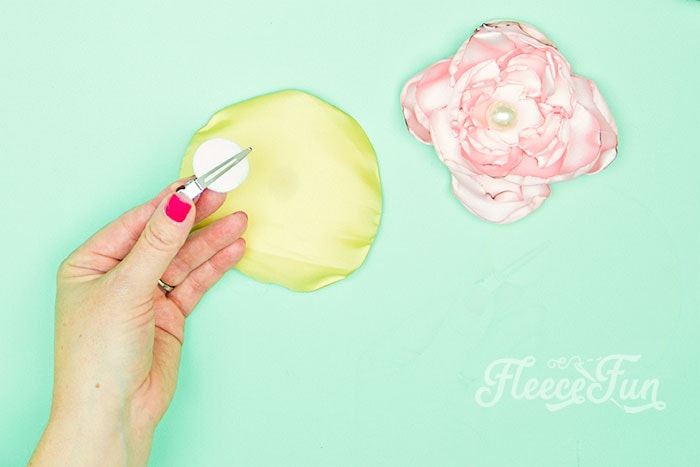 attach a felt circle at the back of the flower