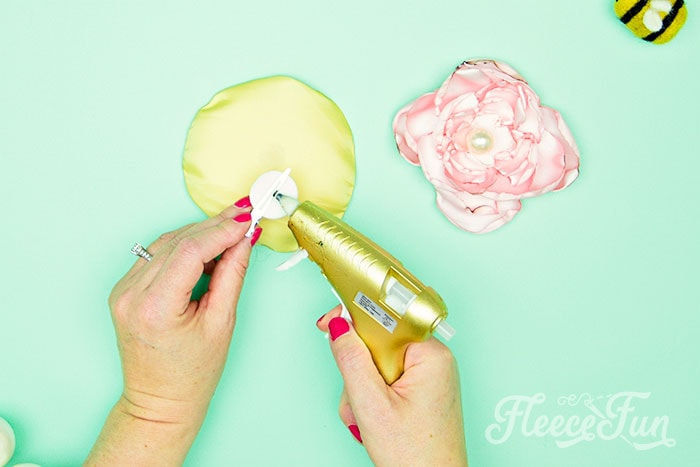 attaching the clip to the back of the flower