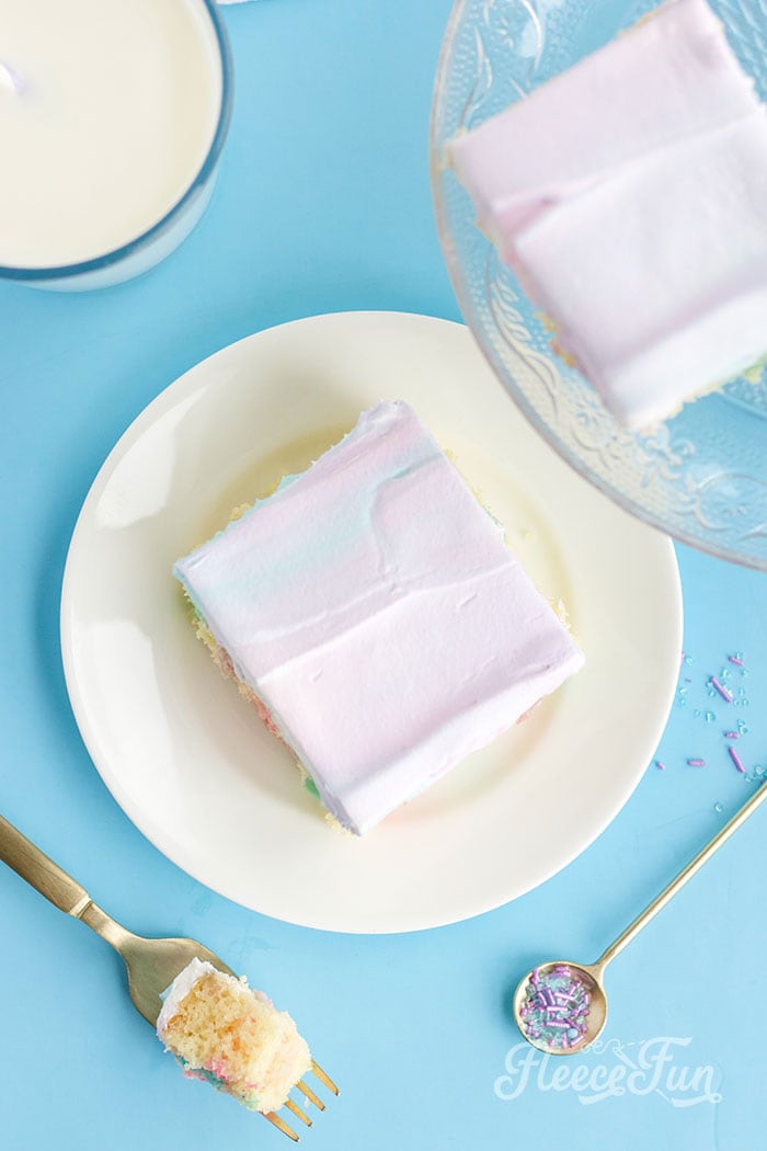 This Super Easy Unicorn Poke Cake Recipe is perfect for a fast fun ( but impressive looking ) treat! Easy to follow instructions make this cake a party winner.