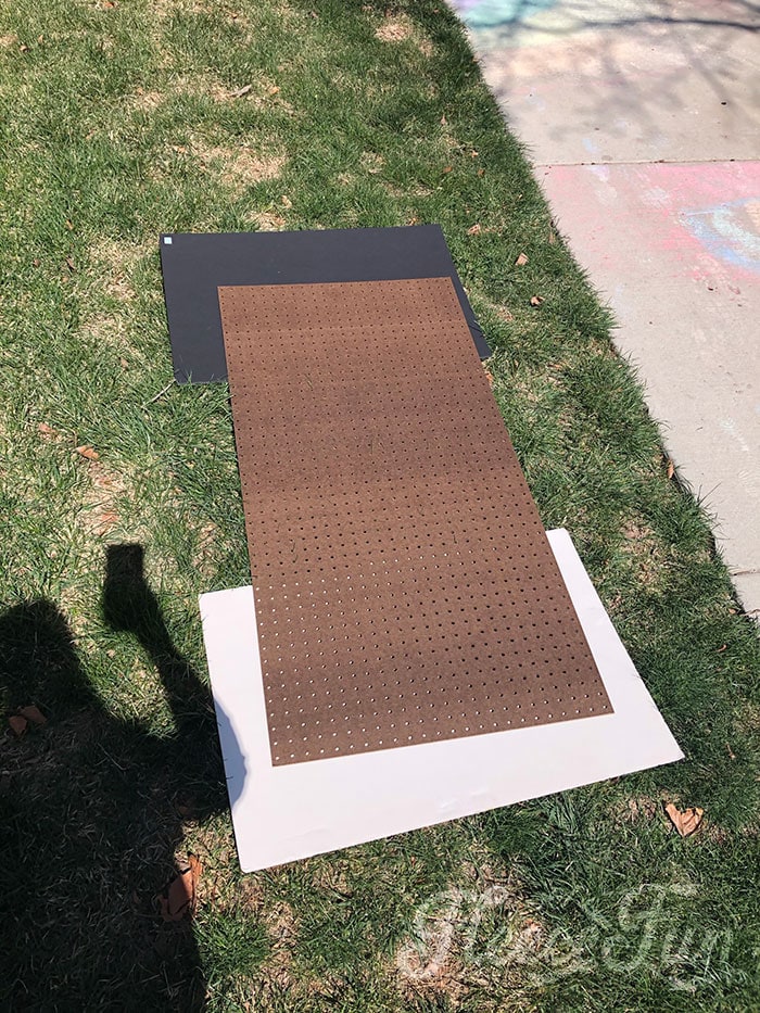 Painting the pegboard.