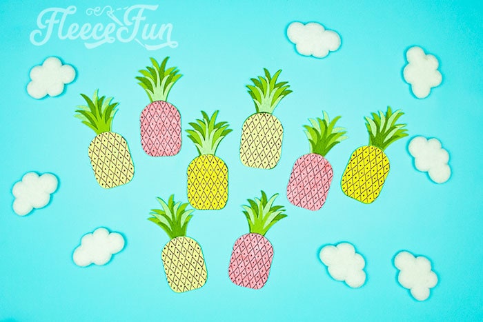 This DIY Pineapple décor is easy to make and has many possibilities! Use the free files to make anything from a cute shirt using HTV to a pillow using fabric.  There is something magical about pineapples.  They brings feeling of warmth, vacation and fun!