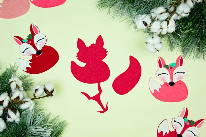 Cutting out felt shapes for the fox ornament following fleecefun’s free template and tutorial.