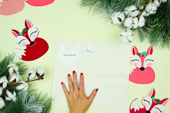 Prepare the felt pieces for the fox ornament using fleecefun’s free Christmas ornament pattern.