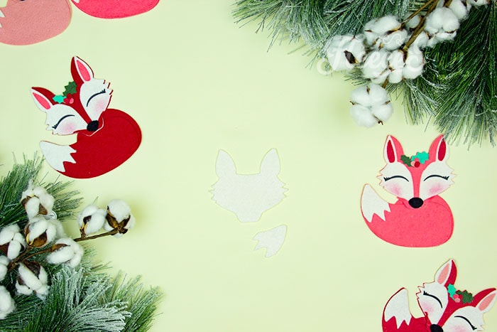Starting the DIY felt fox ornament by cutting out the felt pieces with fleecefun’s free pattern.