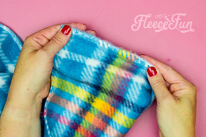 What the edge ofthe fleece looks like. Learn how to make a No Sew Fleece Tie Blanket 3 different ways. Never before seen techniques and FREE templates to make it fast and easy.
