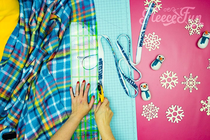 Cutting off selvege. Learn how to make a No Sew Fleece Tie Blanket 3 different ways. Never before seen techniques and FREE templates to make it fast and easy.