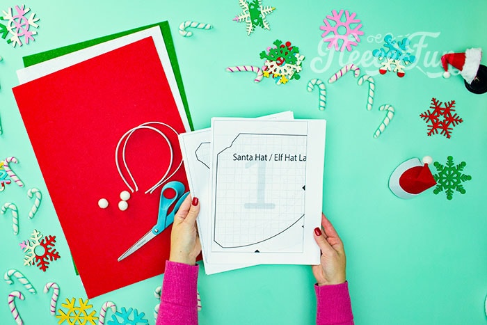 Cut out mini Santa hat pieces using fleecefun's free template and tutorial