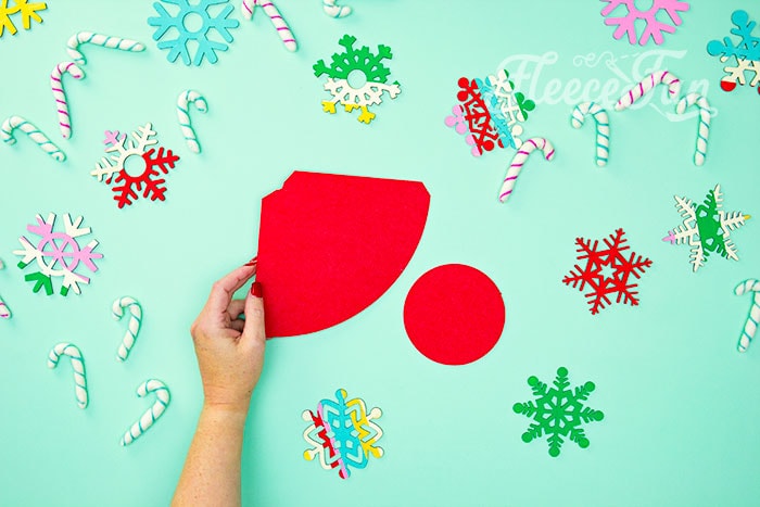 Using fleecefun's free template to cut out pieces for the DIY Santa hat