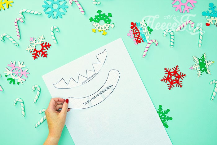 DIY mini Santa hat pieces cut from fleece following fleecefun's tutorial