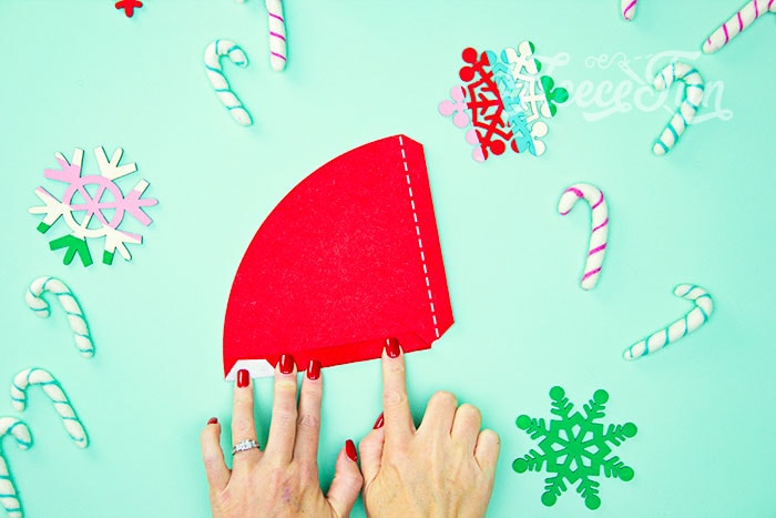 Shaping the mini Santa hat cone using fleecefun's free tutorial