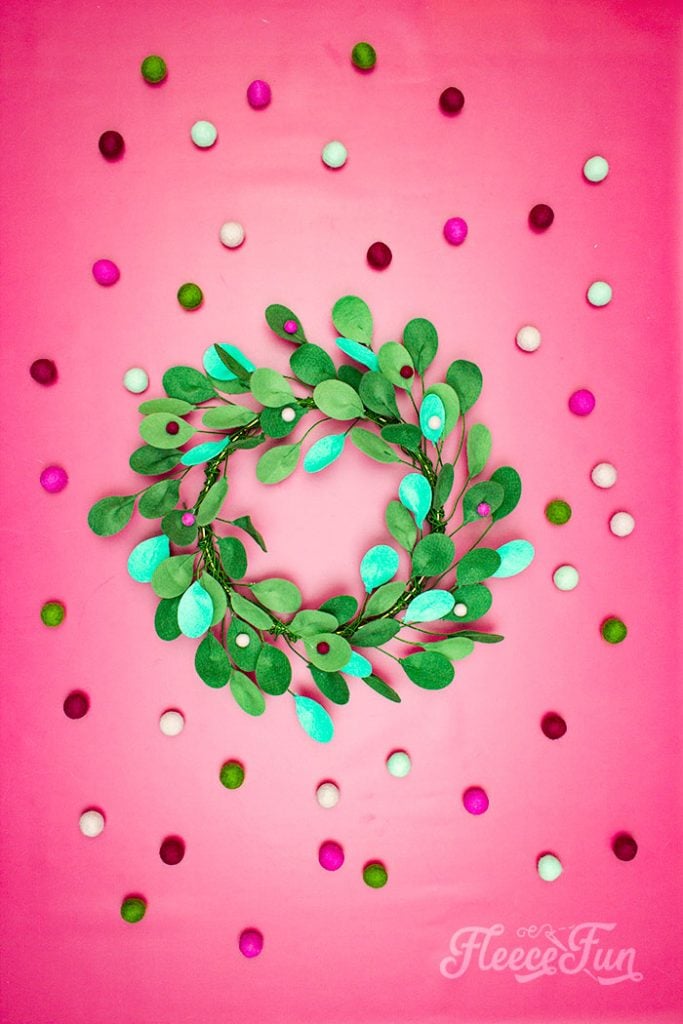 This modern Christmas Wreath DIY (made from felt) is a whimsical addition to your holiday décor. With a few items you can make this festive wreath. Because of the way it's constructed no two are alike. Make it as full or as thin as your taste's desire. Because it's made from felt, this wreath can be made in an array of colors to suit your style.