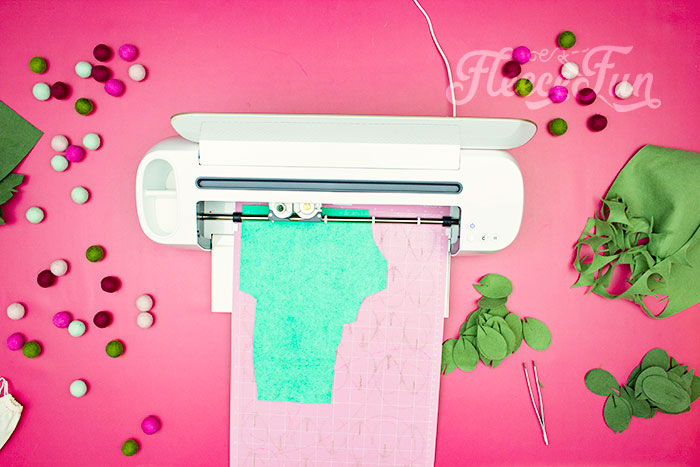 Cricut Maker cutting more felt. This modern Christmas Wreath DIY (made from felt) is a whimsical addition to your holiday décor. With a few items you can make this festive wreath. Because of the way it's constructed no two are alike. Make it as full or as thin as your taste's desire. Because it's made from felt, this wreath can be made in an array of colors to suit your style.