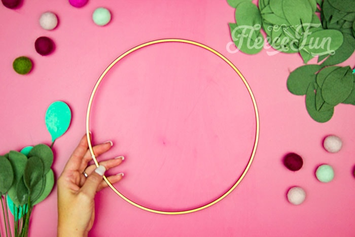 Gold wreath hoop. This modern Christmas Wreath DIY (made from felt) is a whimsical addition to your holiday décor. With a few items you can make this festive wreath. Because of the way it's constructed no two are alike. Make it as full or as thin as your taste's desire. Because it's made from felt, this wreath can be made in an array of colors to suit your style.