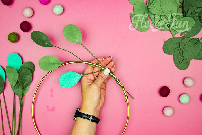 Multiple leaves on the hopp. This modern Christmas Wreath DIY (made from felt) is a whimsical addition to your holiday décor. With a few items you can make this festive wreath. Because of the way it's constructed no two are alike. Make it as full or as thin as your taste's desire. Because it's made from felt, this wreath can be made in an array of colors to suit your style.