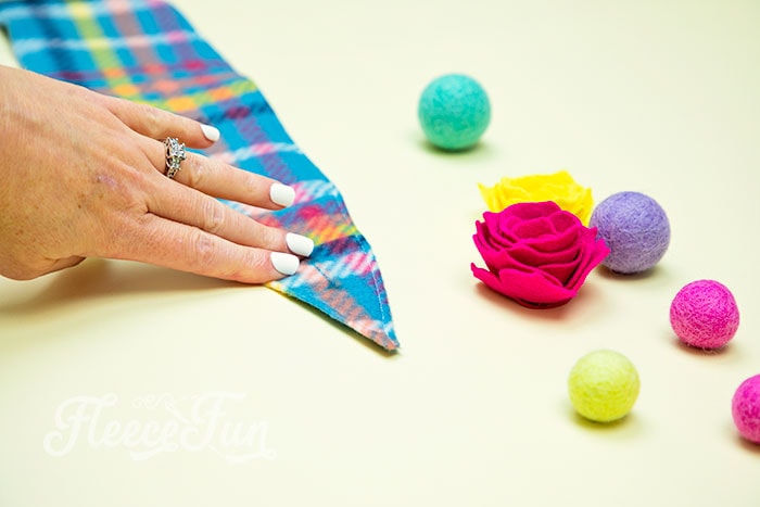 Attaching buttons to the fleece headband ear warmer as per fleecefun's free tutorial.
