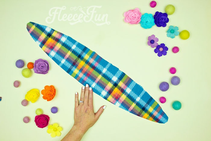 Preparing the fleece fabric by cutting out the headband ear warmer pattern from fleecefun.