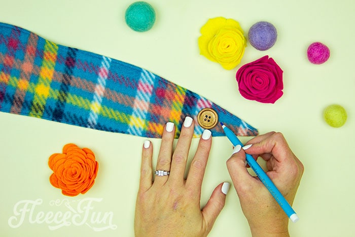 Fleecefun's guide to adding buttonholes and buttons to a fleece ear warmer headband.
