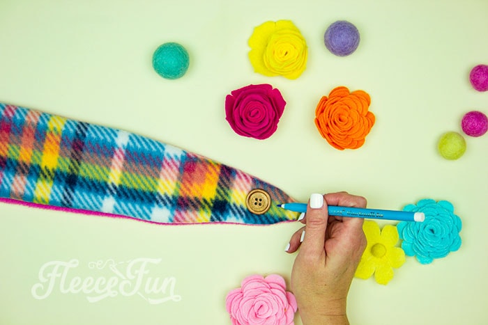 Reversible/ double layer: Attaching buttons to the fleece headband ear warmer as per fleecefun's free tutorial.