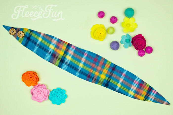 Attaching buttons to the fleece headband ear warmer as per fleecefun's free tutorial.