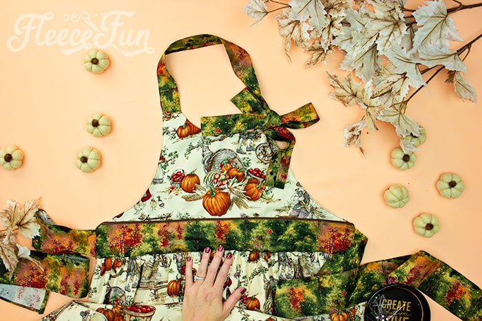 finished apron. This Free apron pattern and tutorial includes a pdf pattern and video! Make a vintage style apron that is chic.