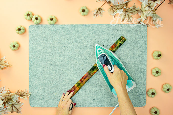 Ironing the strap for FleeceFun free Thanksgiving apron template and sewing guide