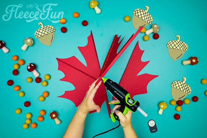 leaf being glued. Step 3: Glue the giant maple leaf together using FleeceFun's free template