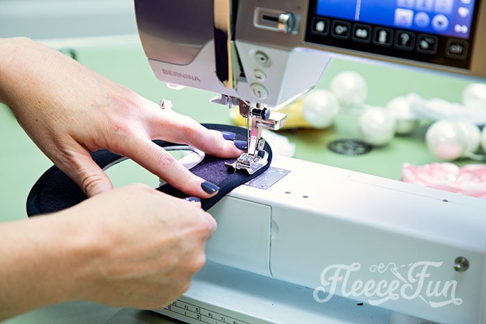 Image of a crafter working on a mini top hat using fleecefun's free template.