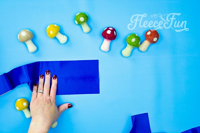 Measuring satin binding for fleece blanket using fleecefun’s free tutorial