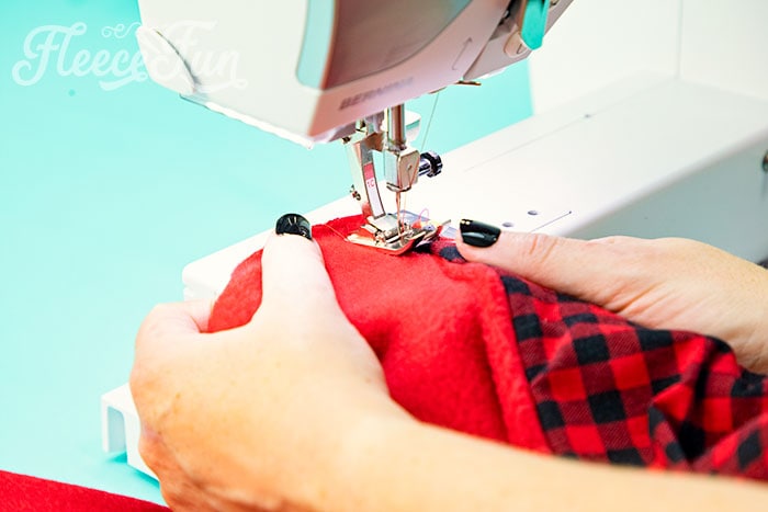 Showing the hood getting sewn to the cape