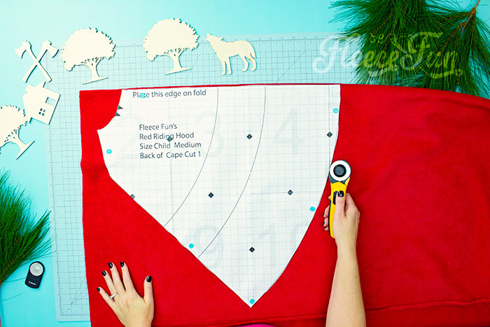 Place the pattern on the fold. Will keep the chill from nipping, but not the wolves. This cape has a video tutorial with a FREE sewing pattern. It's only six steps - looks DIY easy! Love this fleece sewing Project - Red Riding Hood Cape Pattern. It's a great costume pattern that has a classic look. It can work for different costumes. Perfect for Halloween. I love how the sewing tutorial is geared for beginners. It's a great beginner sewing project.