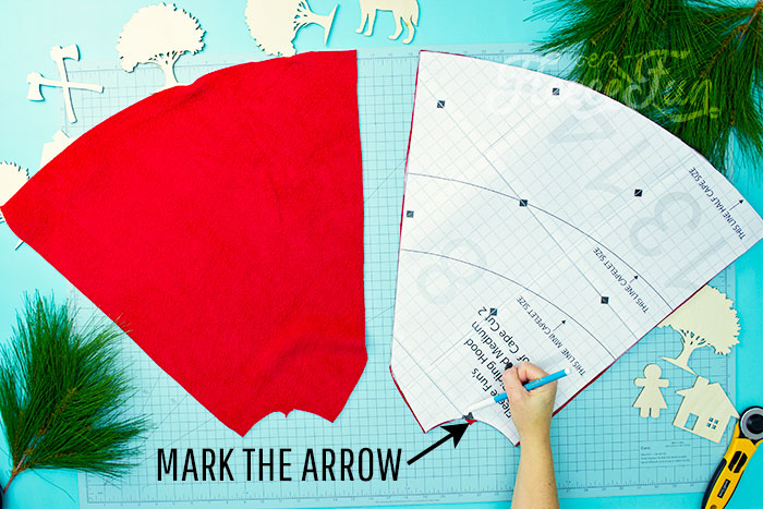 Marking the neck so the hood can line up later. Will keep the chill from nipping, but not the wolves. This cape has a video tutorial with a FREE sewing pattern. It's only six steps - looks DIY easy! Love this fleece sewing Project - Red Riding Hood Cape Pattern. It's a great costume pattern that has a classic look. It can work for different costumes. Perfect for Halloween. I love how the sewing tutorial is geared for beginners. It's a great beginner sewing project.