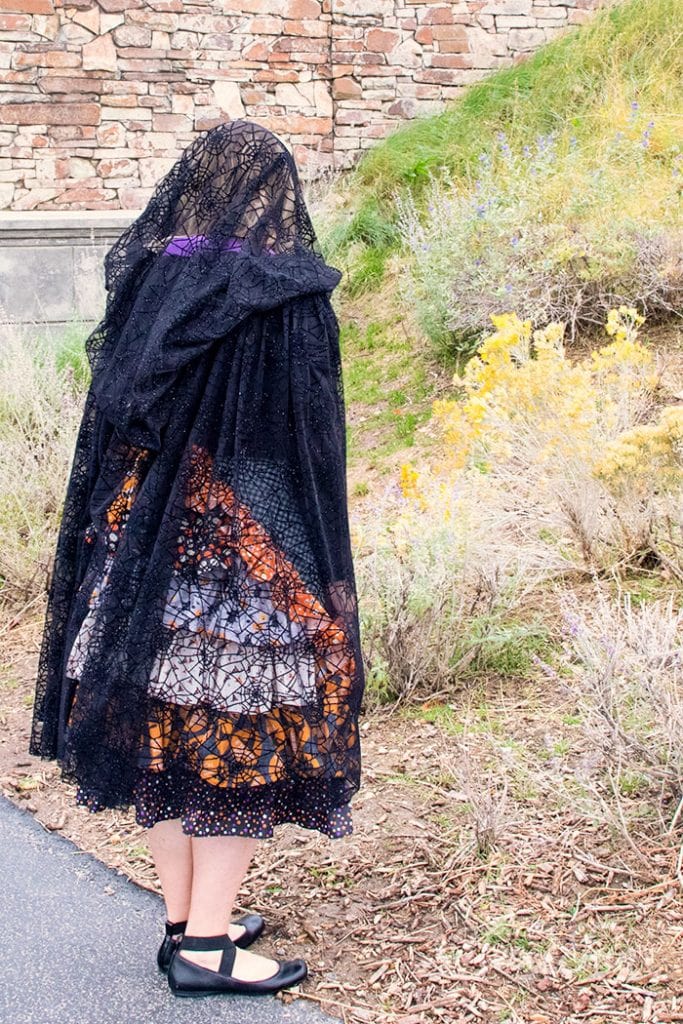 Learn How to Make a Cloak in 20 Minutes (Easy)! This Halloween cape DIY is easy to sew and is a great compliment to costumes. Made from lighter material this easy DIY cloak is made to compliment costumes, without covering them up completely. Because this tutorial requires no pattern - you can easily adjust it for the length and look you want. It can be a long cloak or a short capelet - you decide! If you use the recommended fabric this cape sews up quickly