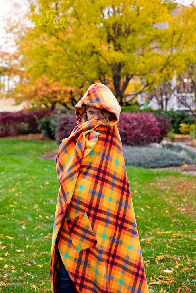 Learn how to make a Hooded Blanket with this free pattern that comes in sizes child and adult. This warm fleece blanket DIY is easy!