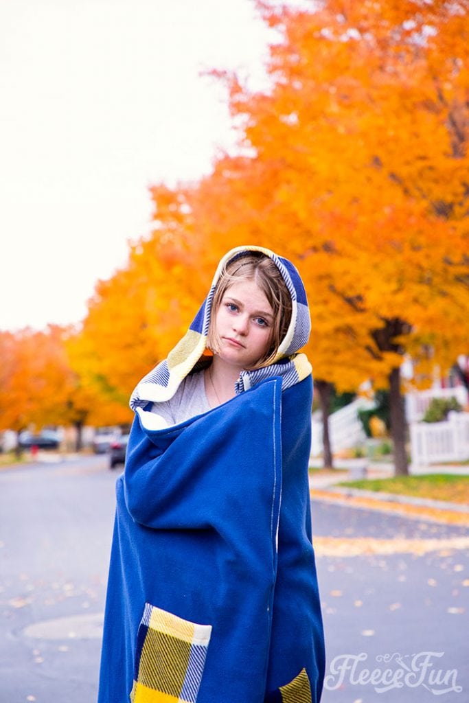 Learn how to make a Hooded Blanket with this free pattern that comes in sizes child and adult. This warm fleece blanket DIY is easy!