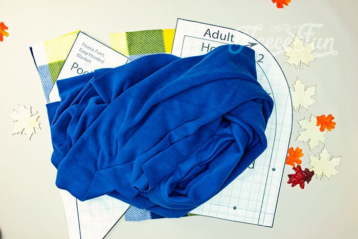Preparing the fabric by cutting the hooded blanket pattern with FleeceFun.