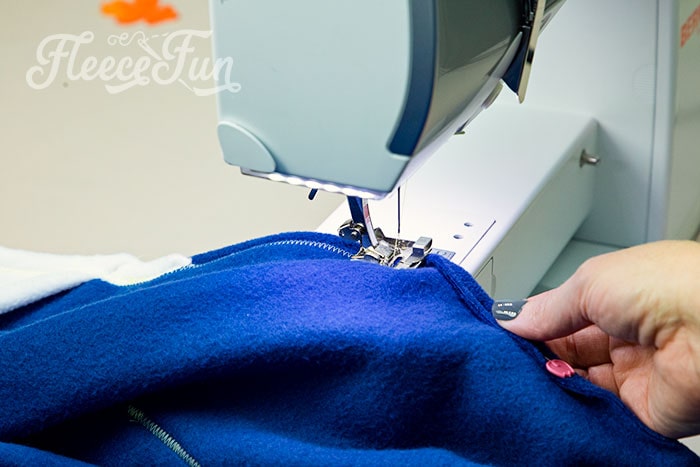 top stitch the handwarmers and hood as well.