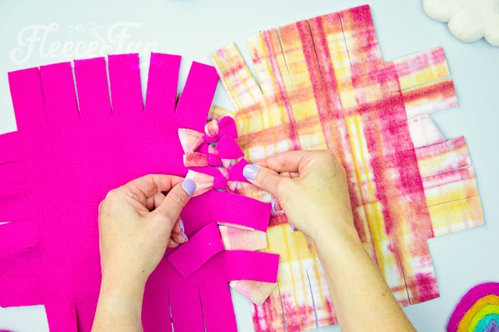 continue tying the squares to make the blanket