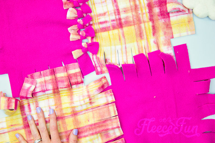 continue tying the squares to make the blanket