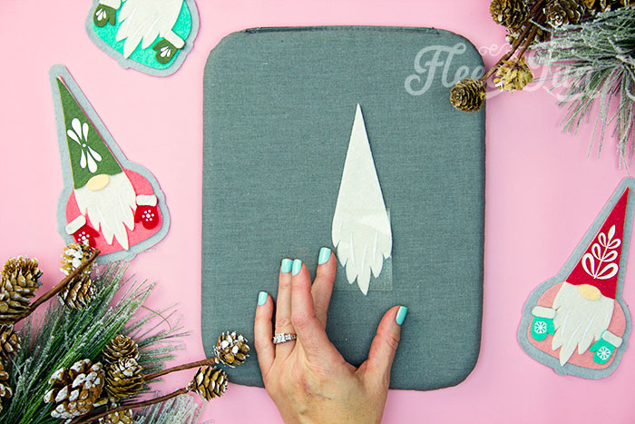 Apply HTV to the no-sew felt gnome ornament with fleecefun’s free tutorial.