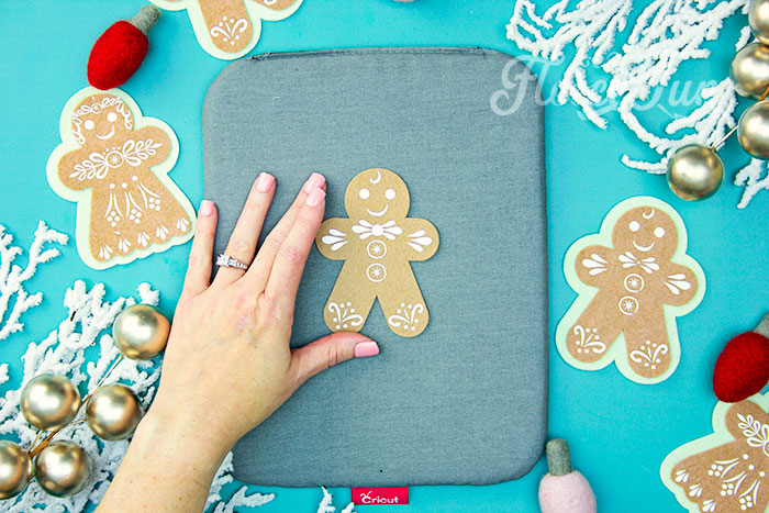 HTV applied to Felt Gingerbread Woman using fleecefun free pattern for customization.