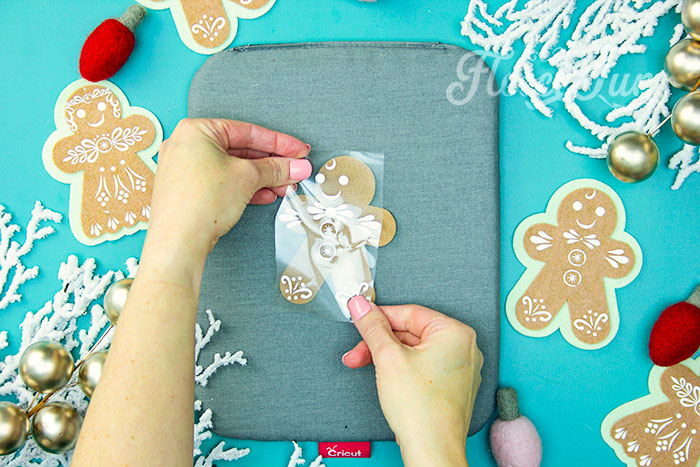 Adding HTV to personalize Felt Gingerbread Man with fleecefun free template tutorial.