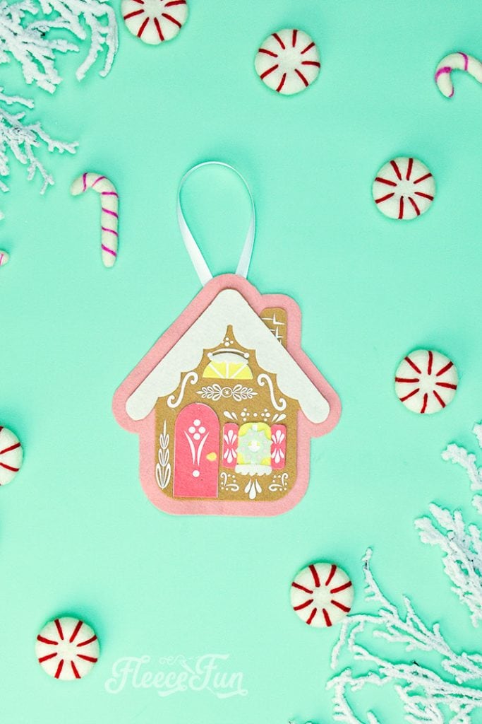 This Gingerbread House Ornaments DIY (free felt Christmas ornament pattern) is a fun and whimsical addition to your holiday tree! This no sew felt Christmas Ornament has layers of felt to give the ornament dimension. HTV is used to ass the fun decorative details. While my chosen medium is felt and HTV - this ornament can also be made from cardstock and vinyl, chipboard, or wood.