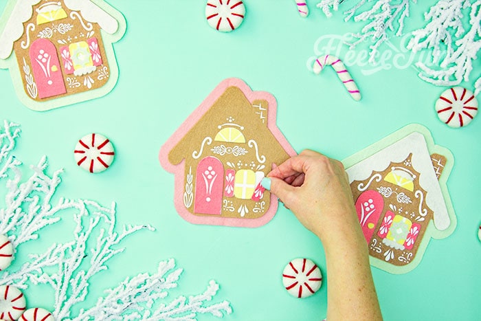 DIY assembly of the felt gingerbread house ornament following fleecefun’s free tutorial